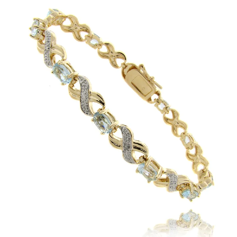 Dolce Giavonna Gold Overlay Blue Topaz and Diamond Accent 'X' and 'O' Bracelet